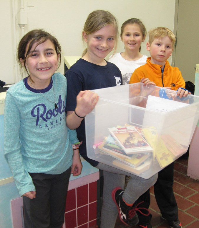 Members of the service squad collect books.