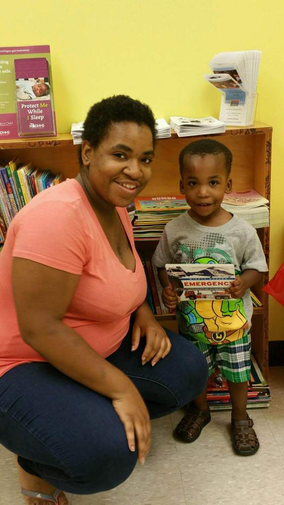 Christopher Boston and his Mom pick out a new book