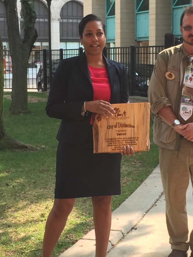 Ms. Aliyah Sabree, the Mayor's Liason to the City Council, accepts the award on behalf of the city.