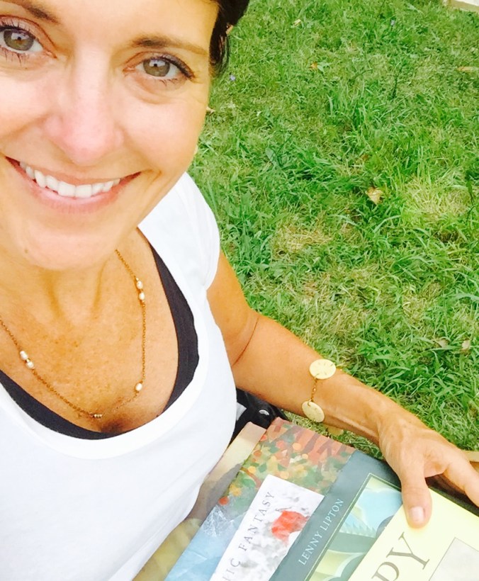 Our incredible RX for Reading volunteer and UDM School Psychology graduate student Beth Jordon with some of the books she brought to Finale Friday.