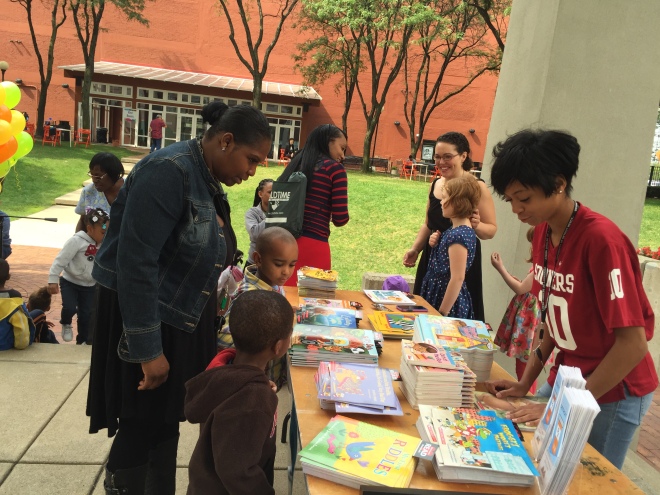 RX for Reading volunteer and UDM undergraduate Renesha Smoot Grafton helps kids pick out their books.